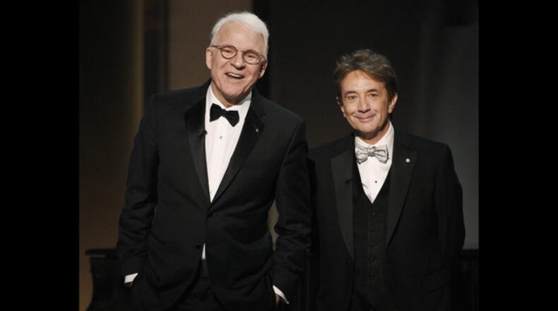 In this June 8, 2017 file photo, Steve Martin, left, and Martin Short appear at the 45th AFI Life Achievement Award Tribute to Diane Keaton in Los Angeles. Longtime friends Steve Martin and Martin Short were hitting the road together in 2020, but the tour has been nixed due to coronavirus.