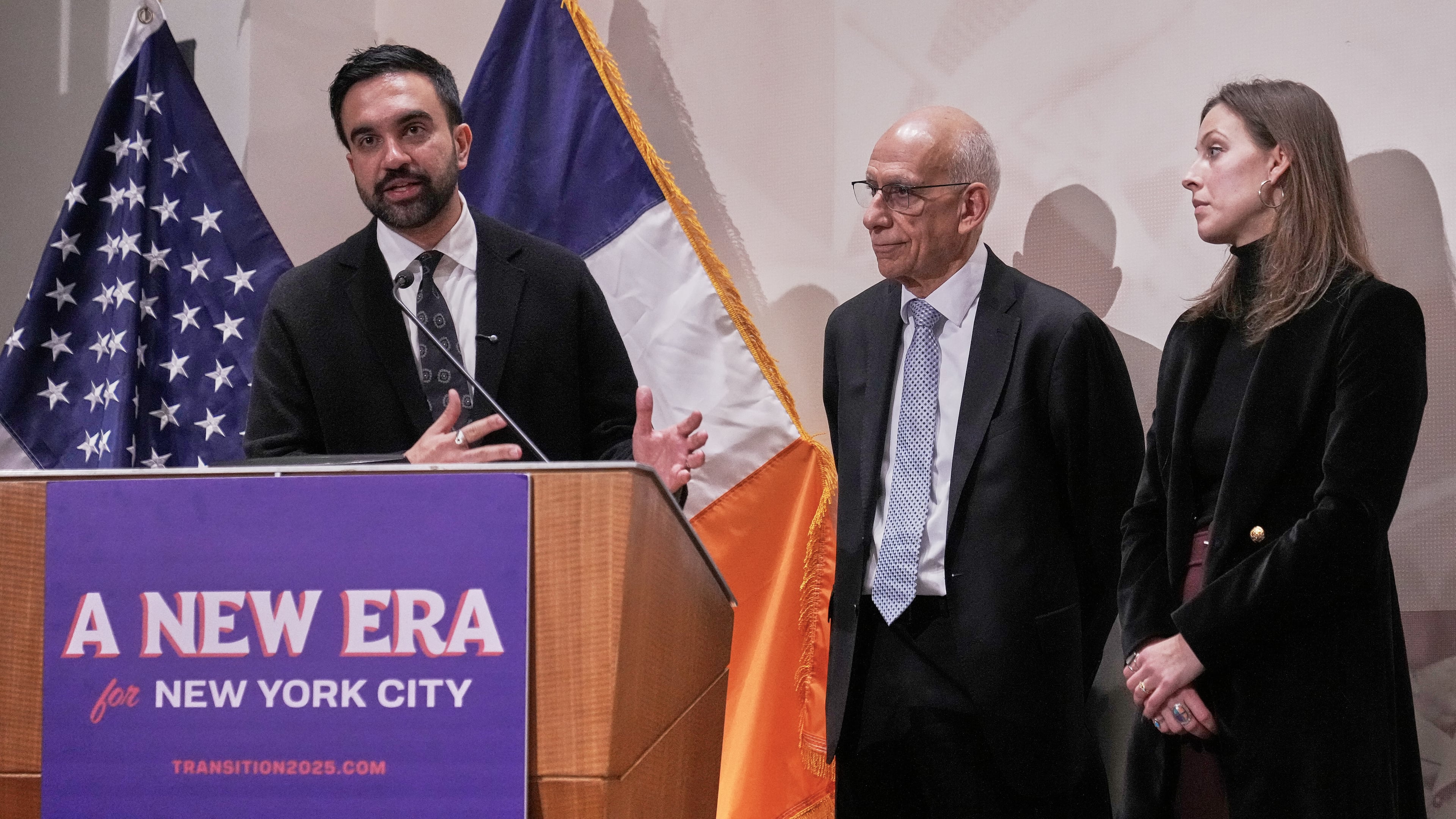 CORRECTS NAME SPELLING: New York Mayor-elect Zohran Mamdani, left, announces the appointment of Dean Fuleihan, center, as first deputy mayor and Elle Bisgaard-Church as chief of staff, in New York, Monday, Nov. 10, 2025. (AP Photo/Richard Drew)