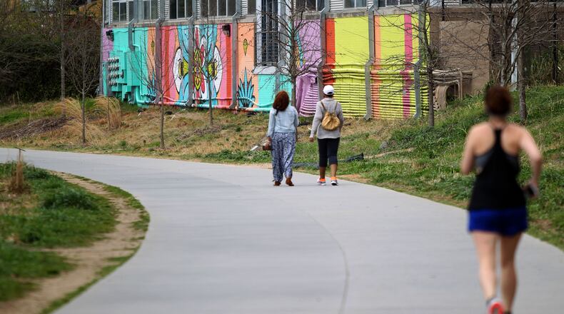 Pedestrians walk along part of the Eastside Trail on the Atlanta Beltline