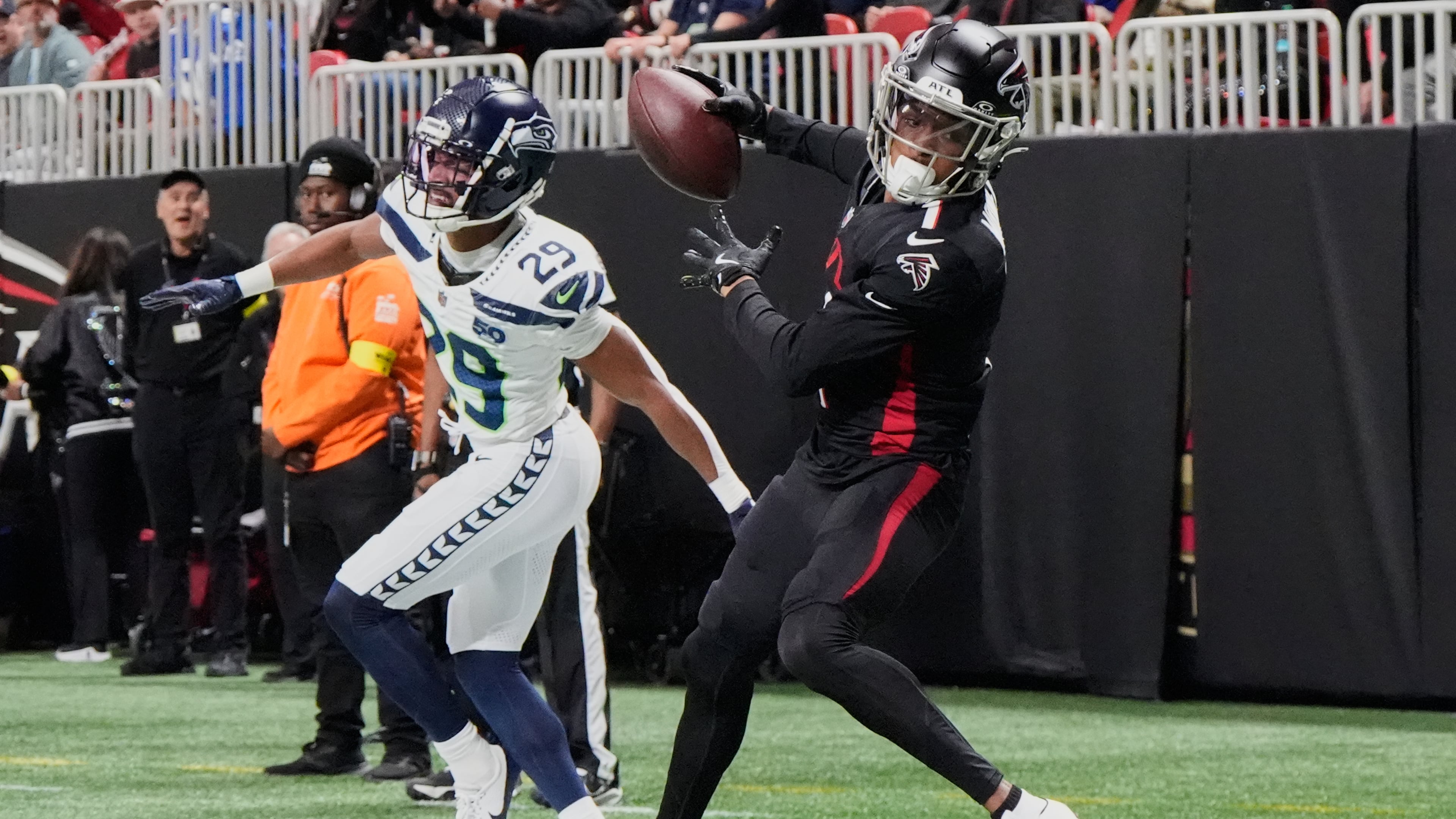 Atlanta Falcons wide receiver Darnell Mooney makes a catch against Seattle Seahawks cornerback Josh Jobe during the first half of an NFL football game, Sunday, Dec. 7, 2025, in Atlanta. (Mike Stewart/AP)