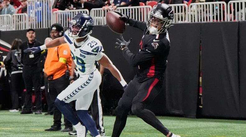 Atlanta Falcons wide receiver Darnell Mooney makes a catch against Seattle Seahawks cornerback Josh Jobe during the first half of an NFL football game, Sunday, Dec. 7, 2025, in Atlanta. (Mike Stewart/AP)