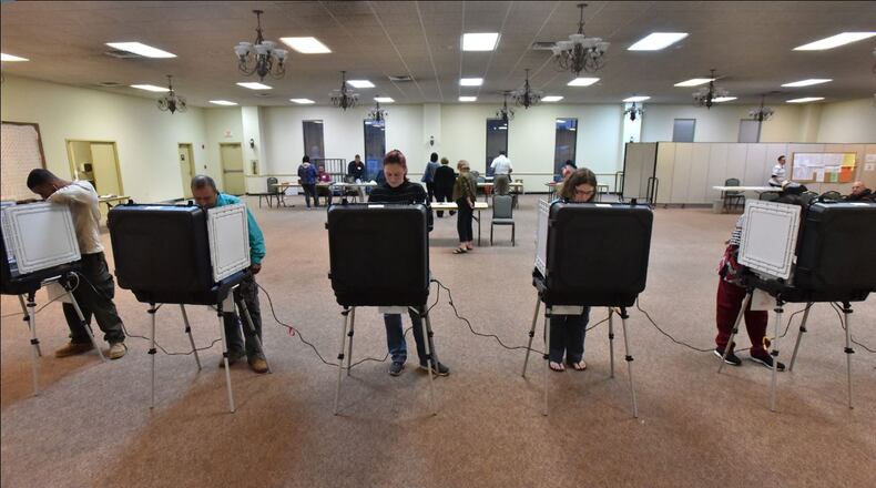 Gwinnett County residents cast their votes in the 2016 presidential election at First Baptist Church of Lilburn. HYOSUB SHIN / HSHIN@AJC.COM