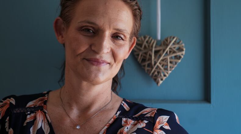 Jessica Thompson, 47, sits for a portrait at her Rockford, Ill., home on Saturday, March 21, 2026. (AP Photo/Erin Hooley)