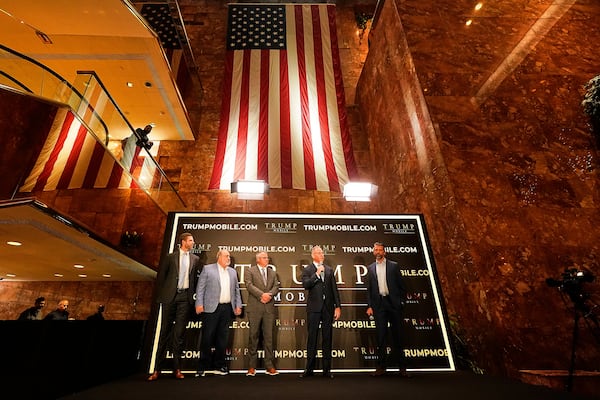 Eric Trump, Don Hendrickson, Eric Thomas, Patrick O'Brien and Donald Trump Jr., left to right, participate in the announcement of Trump Mobile, in New York's Trump Tower, Monday, June 16, 2025. (AP Photo/Richard Drew)
