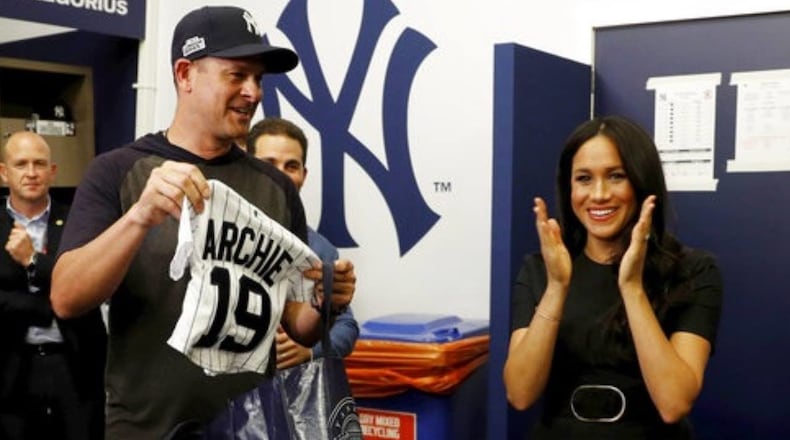 Meghan Markle, the Duchess of Sussex, applauds as the New York Yankees present a jersey for baby Archie before the team met the Boston Red Sox in London on Saturday.
