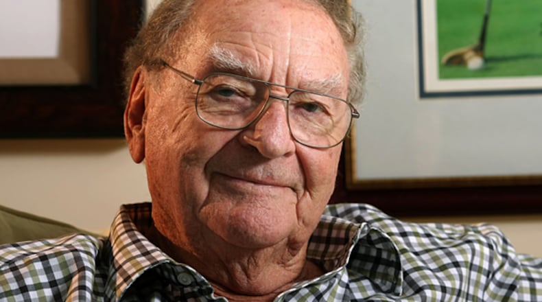 Award winning AJC sports writer Furman Bisher sat for this photo in his basement full of memorabilia on Oct. 9, 2009, in Fayetteville, Ga.
