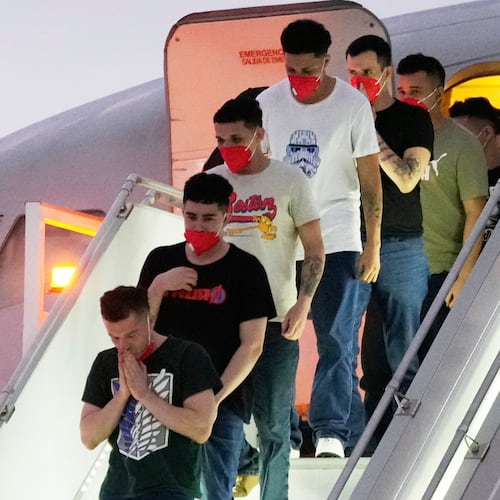 FILE - Migrants deported months before by the United States to El Salvador under the Trump administration's immigration crackdown arrive at Simon Bolívar International Airport in Maiquetia, Venezuela, July 18, 2025. (AP Photo/Ariana Cubillos, File)