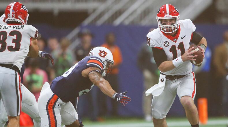 Georgia quarterback Jake Fromm (11) works against Auburn during the first half of the Southeastern Conference championship NCAA college football game, Saturday, Dec. 2, 2017, in Atlanta. (AP Photo/John Bazemore)