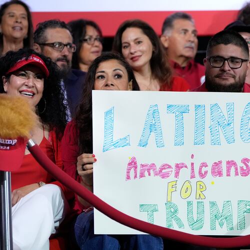 FILE - Supporters hold a sign before Republican presidential nominee former President Donald Trump arrives to speak during a campaign event, Sept.12, 2024, in Tucson, Ariz. (AP Photo/Alex Brandon, File)