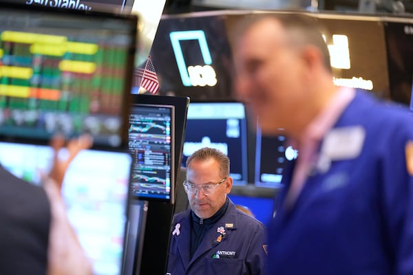 Anthony Matesic works on the floor at the New York Stock Exchange in New York, Wednesday, July 16, 2025. (AP Photo/Seth Wenig)