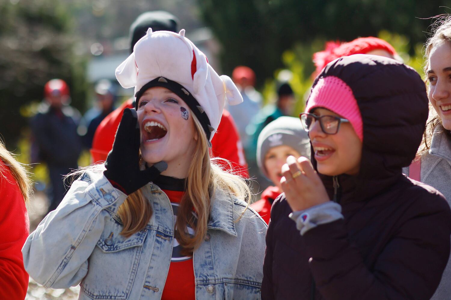 UGA students Ansley Little, left, and Ariana Scarpaci celebrates the Bulldogs back-to-back national champions at the team's victory parade in Athens on Saturday, January 14, 2023.  Miguel Martinez / miguel.martinezjimenez@ajc.com