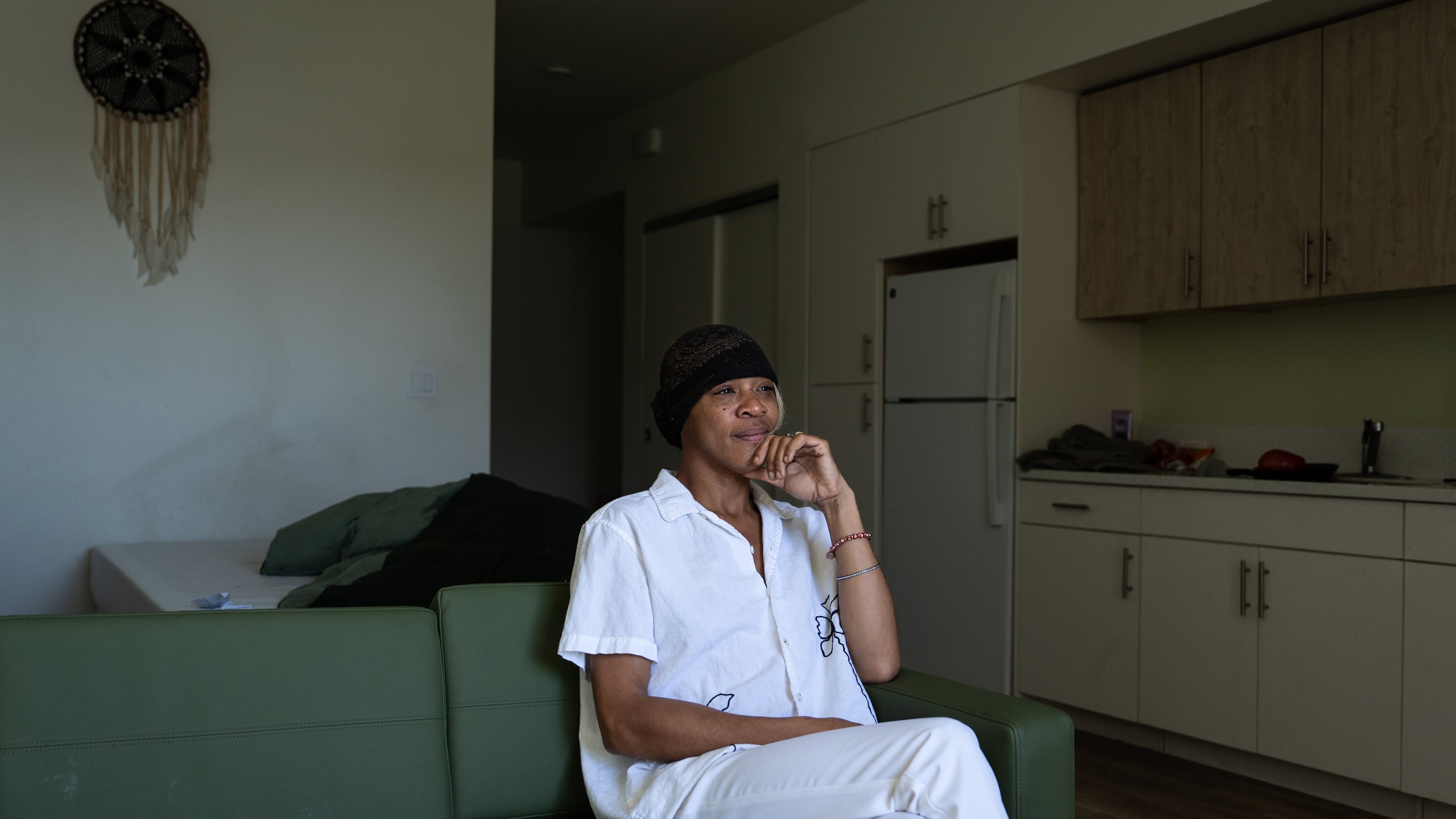 Quantavia Smith sits for a photo in her studio apartment at the Santa Monica and Vermont Apartments in Los Angeles, Monday, Nov. 10, 2025. (AP Photo/Jae C. Hong)