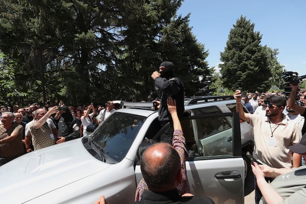 Armenian National Security Service officers arrive to arrest Mikael Ajapahyan, Archbishop of Gyumri and Shirak, at Echmiadzin, the seat of the Armenian Apostolic Church outside Yerevan, Armenia, Friday, June 27, 2025. (Hayk Baghdasaryan/Photolure via AP)