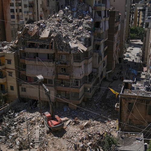Rescue workers search through the rubble of a building destroyed in an Israeli airstrike the previous day in Dahiyeh, Beirut's southern suburbs, Lebanon, Thursday, May 7, 2026. (AP Photo/Bilal Hussein)