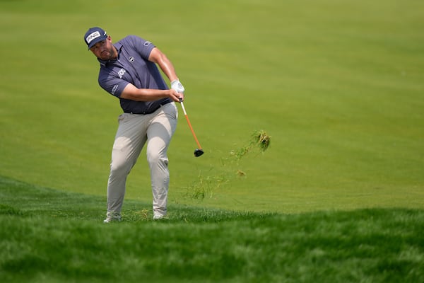 Thriston Lawrence, of South Africa, hits from the 18th fairway during the first round of the U.S. Open golf tournament at Oakmont Country Club Thursday, June 12, 2025, in Oakmont, Pa. (AP Photo/Charlie Riedel)