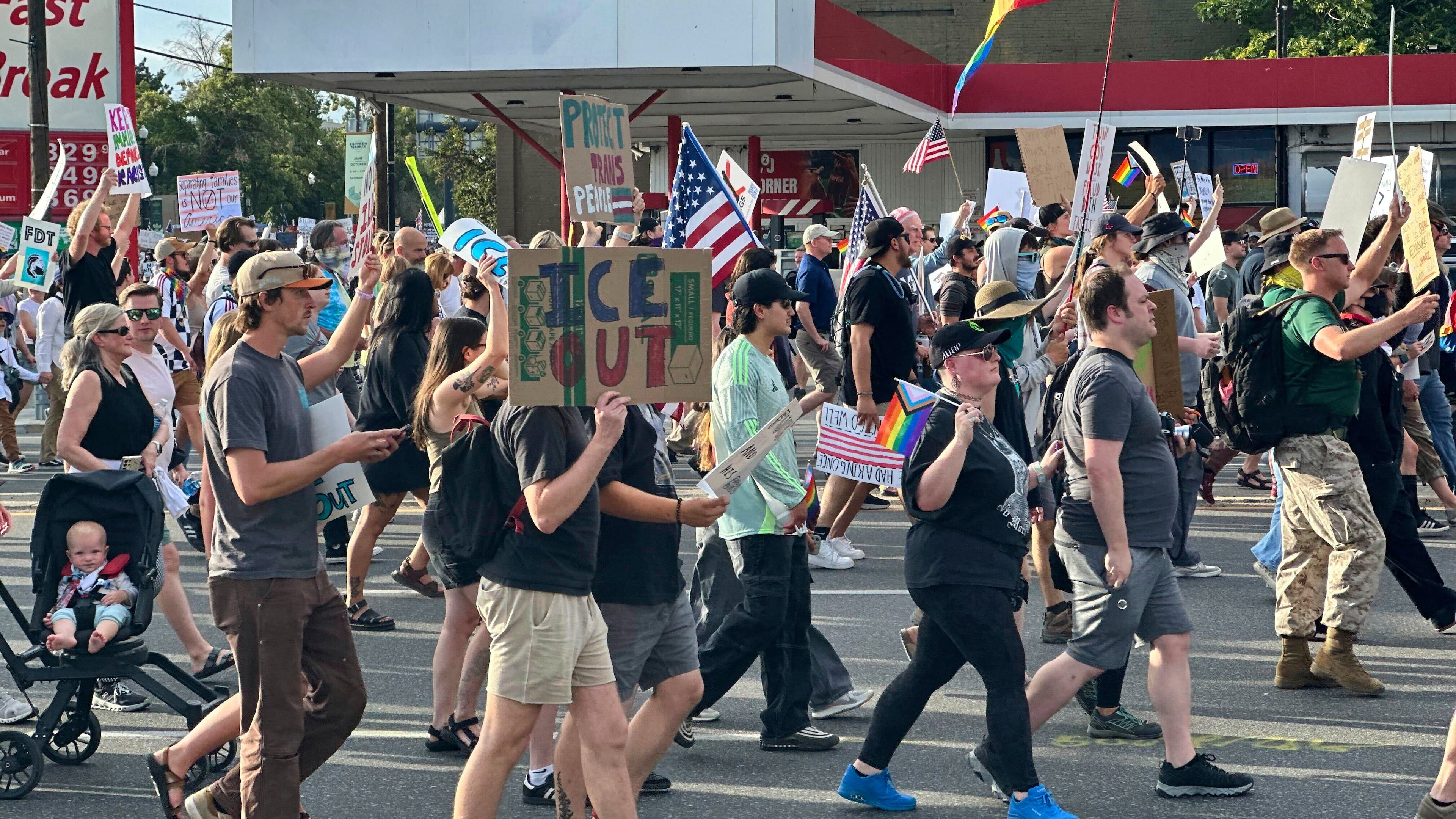 FILE - Demonstrators carry signs and chant while marching during a "No Kings" protest, June 14, 2025, in Salt Lake City. (AP Photo/Amanda Barrett, file)
