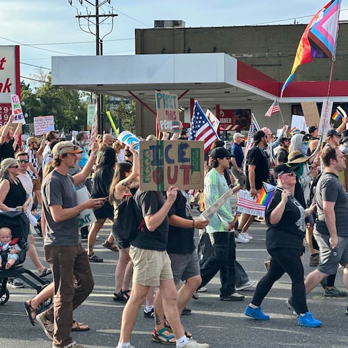 FILE - Demonstrators carry signs and chant while marching during a "No Kings" protest, June 14, 2025, in Salt Lake City. (AP Photo/Amanda Barrett, file)