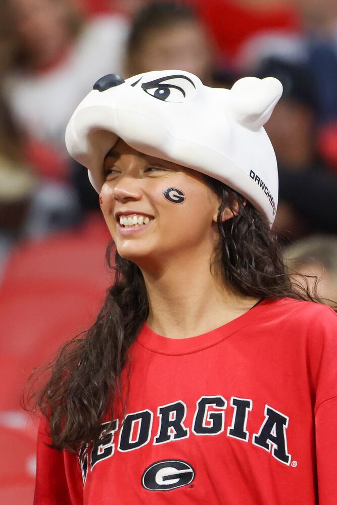 A Georgia Bulldogs fan prepares for the SEC Championship Game against the LSU Tigers at Mercedes-Benz Stadium in Atlanta on Saturday, Dec. 3, 2022. (Jason Getz / Jason.Getz@ajc.com)