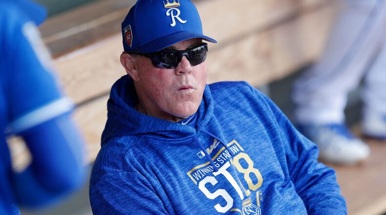 Kansas City Royals manager Ned Yost sits in the dugout before a spring training baseball game against the Cincinnati Reds, Wednesday, Feb. 28, 2018, in Surprise, Ariz. (AP Photo/Charlie Neibergall) ORG XMIT: AZCN1