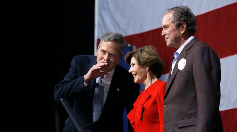 Former President George W. Bush, right, and former first lady Laura Bush campaign with his brother, Republican presidential candidate Jeb Bush, left, in Charleston, S.C., on Monday. Carolyn Cole/Los Angeles Times/TNS