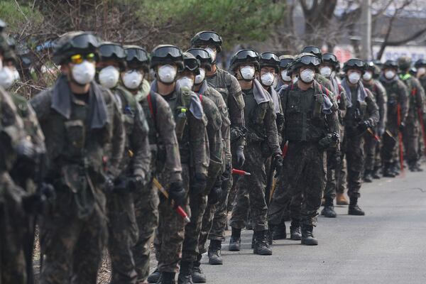 South Korean soldiers arrive to prevent the further spread of wildfires in Uiseong, South Korea, Thursday, March 27, 2025. (Yoon Kwan-shik/Yonhap via AP)