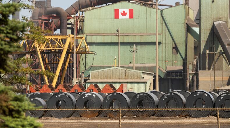 Rolled coils of steel sit in the yard at the ArcelorMittal Dofasco steel plant in Hamilton, Ont. on Thursday, Aug. 20, 2026. (Nick Iwanyshyn /The Canadian Press via AP)