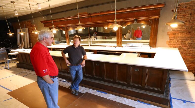 April 29, 2020 Marietta: Mayor Steve Tumlin (left) talks with contractor Gordon Brans (right) while stopping by to look over the finishing touches on Mac’s Chophouse restaurant on Wednesday, April 29, 2020, on the square in Marietta. While renovations are almost done at the space that once housed Shillings on Marietta Square owner Randy McCray has said he won’t open the new restaurant until he feels comfortable things are better. Curtis Compton ccompton@ajc.com