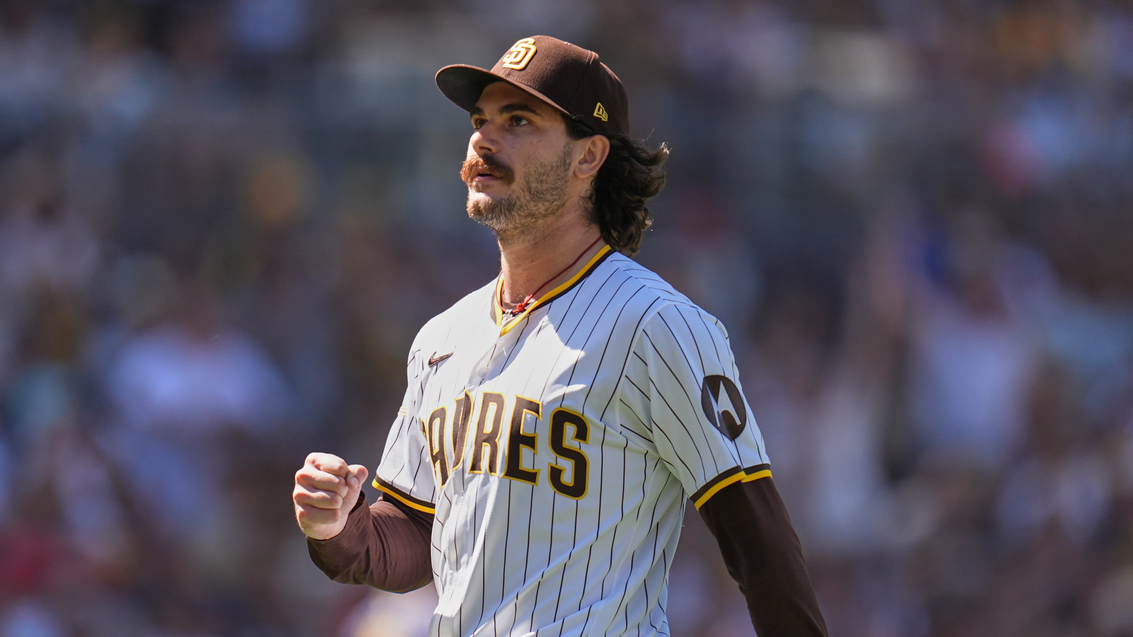 FILE - San Diego Padres starting pitcher Dylan Cease celebrates after the third out during the third inning of a baseball game against the Milwaukee Brewers, Sept. 24, 2025, in San Diego. (AP Photo/Gregory Bull, File)