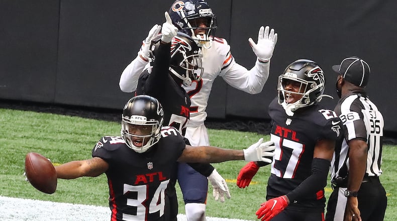 Falcons cornerback Darqueze Dennard gets the interception in the end zone against Chicago Bears wide receiver Allen Robinson during the third quarter Sunday, Sept. 27, 2020, in Atlanta.  (Curtis Compton / Curtis.Compton@ajc.com)