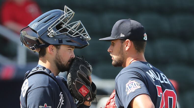 030221 North Port: Atlanta Braves pitcher Kyle Muller confers with catcher Shea Langeliers during the fifth inning against the Minnesota Twins in a MLB spring training baseball game at CoolToday Park on Tuesday, March 2, 2021, in North Port. Curtis Compton / Curtis.Compton@ajc.com”