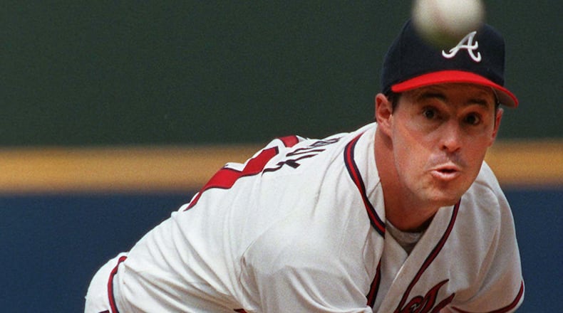 Atlanta Braves pitcher Greg Maddux throws to the plate during sixth inning of a baseball game against the Chicago Cubs in Atlanta  The Braves plan to retire Maddux's No. 31 during a ceremony on July 17 in Atlanta. (AP Photo/John Bazemore, File)