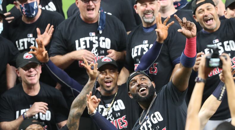 It’s selfie time led by Marcell Ozuna (right) with Ronald Acuna and Ozzie Albies as the Braves celebrate advancing to the NL Championship Series by defeating the Marlins 7-0 in Game 3 of the NLDS completing their second consecutive postseason series sweep on Thursday, Oct 8, 2020 in Houston.   “Curtis Compton / Curtis.Compton@ajc.com”