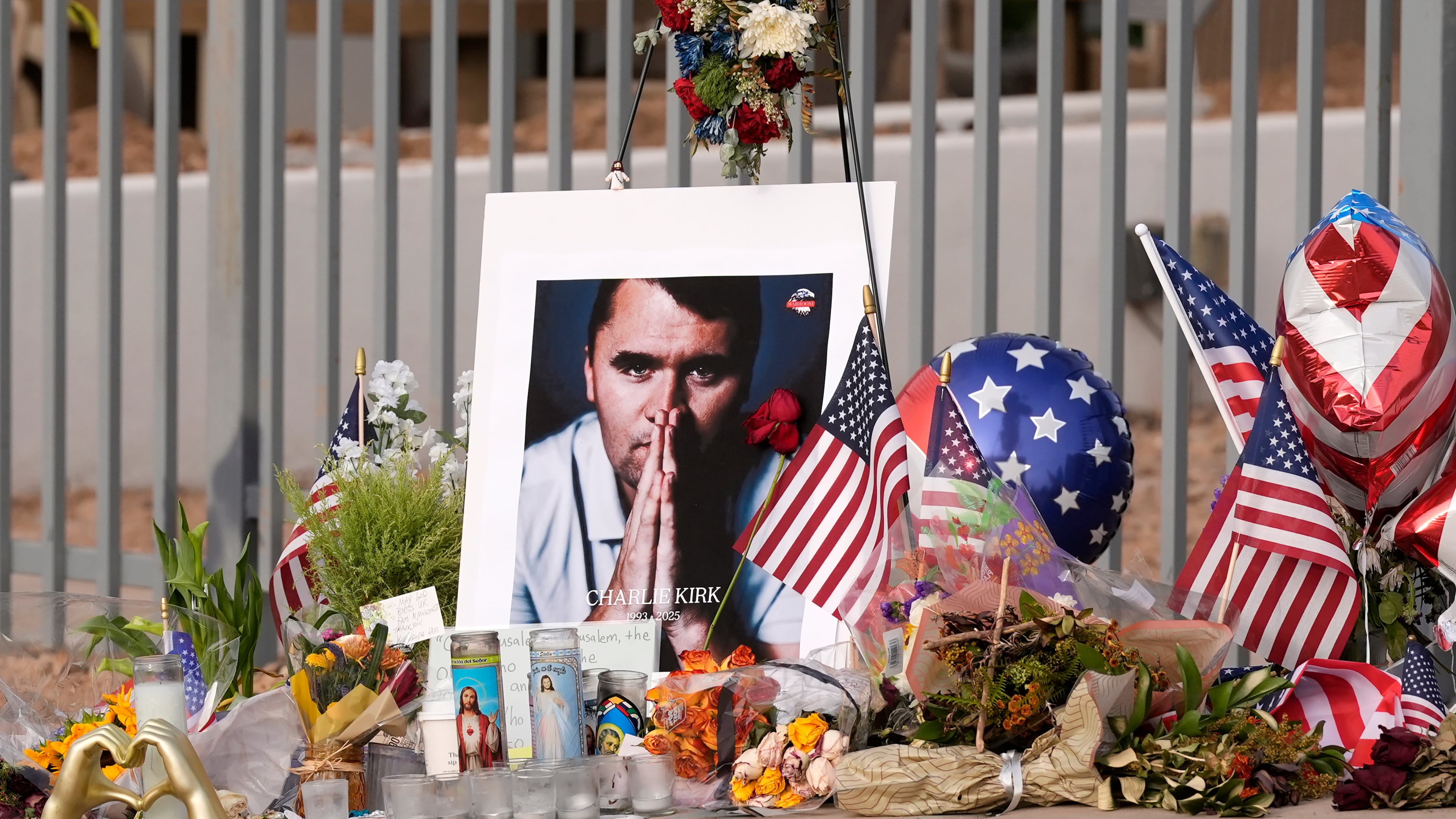 FILE - A makeshift memorial grows in size at the Turning Point USA headquarters after the shooting death at a Utah college of Charlie Kirk, the 31-year-old founder and CEO of the organization, Sept. 17, 2025, in Phoenix. (AP Photo/Ross D. Franklin, File)