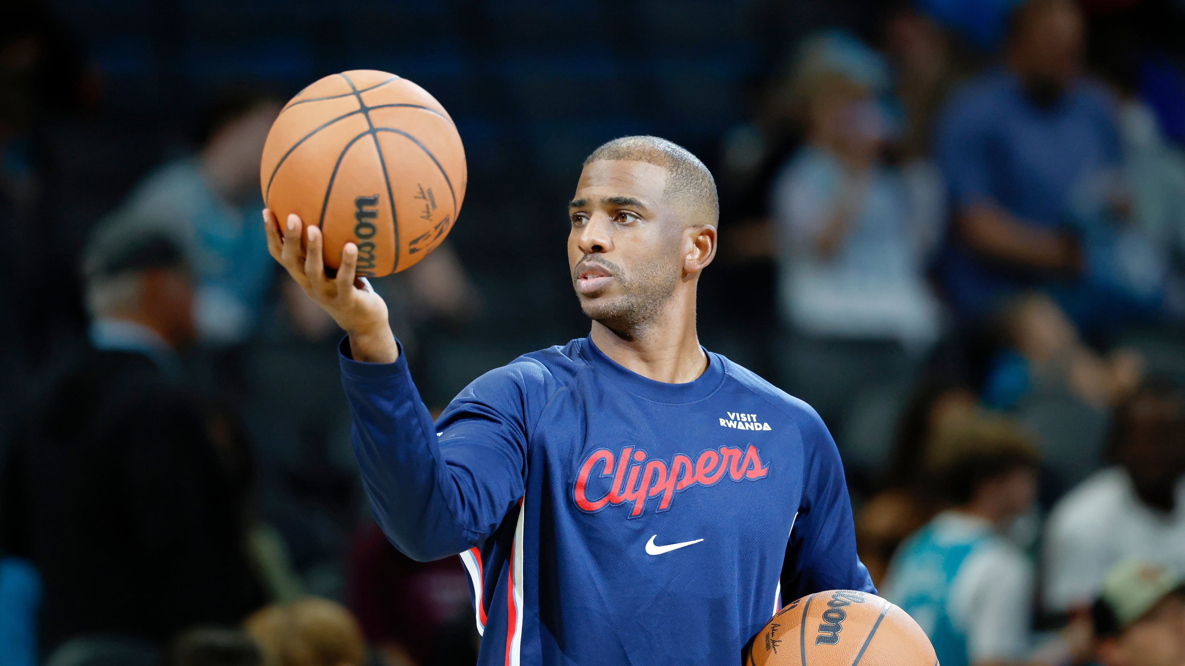 Los Angeles Clippers guard Chris Paul warms up before of an NBA basketball game against the Charlotte Hornets in Charlotte, N.C., Saturday, Nov. 22, 2025. (AP Photo/Nell Redmond)
