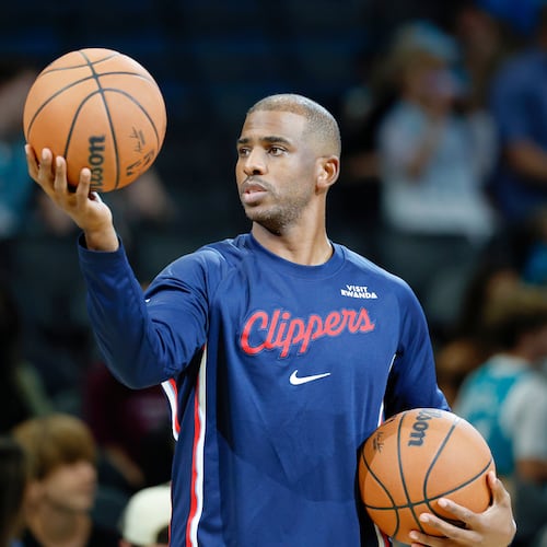 Los Angeles Clippers guard Chris Paul warms up before of an NBA basketball game against the Charlotte Hornets in Charlotte, N.C., Saturday, Nov. 22, 2025. (AP Photo/Nell Redmond)
