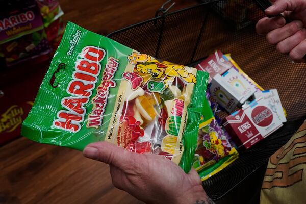A shopper chooses Haribo candy from Germany, at Economy Candy on New York's Lower East Side, Friday, April 4, 2025. (AP Photo/Richard Drew)