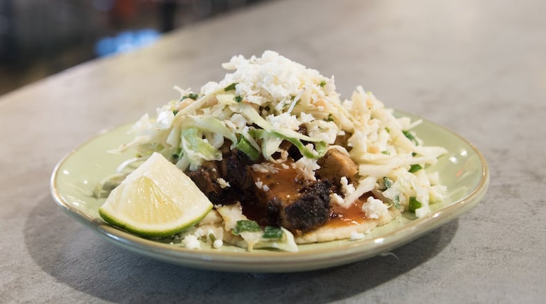 Babalu gets it right when it comes to dressing the pork belly taco, a fatty, rich, tender concoction. CONTRIBUTED BY HENRI HOLLIS