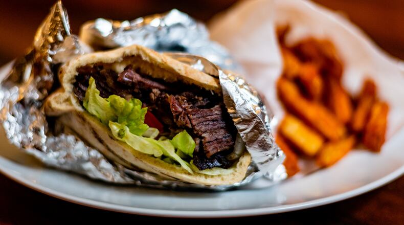 The MacDougal pita sandwich at Mamoun's Falafel contains both lamb shawarma and falafel.