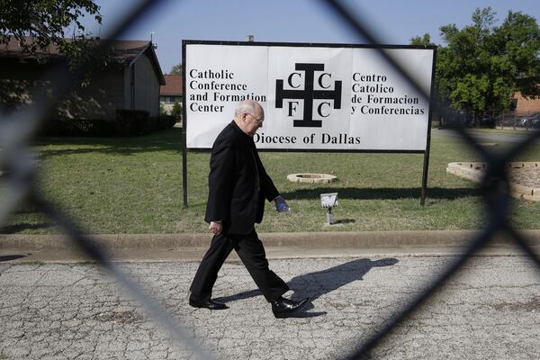 FILE - Catholic Bishop Kevin Farrell walks to speak to media outside the the Diocese of Dallas Catholic Conference and Formation Center on Oct. 20, 2014. (AP Photo/LM Otero, File)