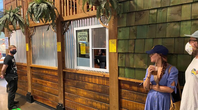 At Ticonderoga Club in Krog Street Market, customers can order to-go cocktails at a takeout window. Bob Townsend for The Atlanta Journal-Constitution