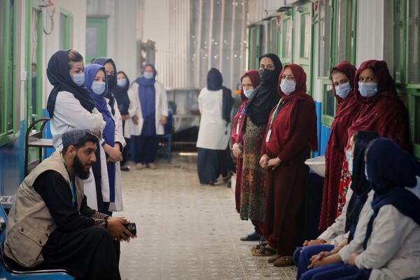 Staff members wait for their director at Action Against Hunger's therapeutic feeding unit in Kabul, Afghanistan, Tuesday, April 15, 2025. (AP Photo/Siddiqullah Alizai)