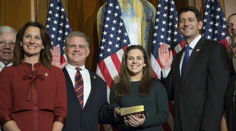 House Speaker Paul Ryan of Wisconsin, right, administers the House oath of office to U.S. Rep. Drew Ferguson, R-West Point, during a mock swearing-in ceremony Tuesday in Washington. (AP Photo/Zach Gibson)
