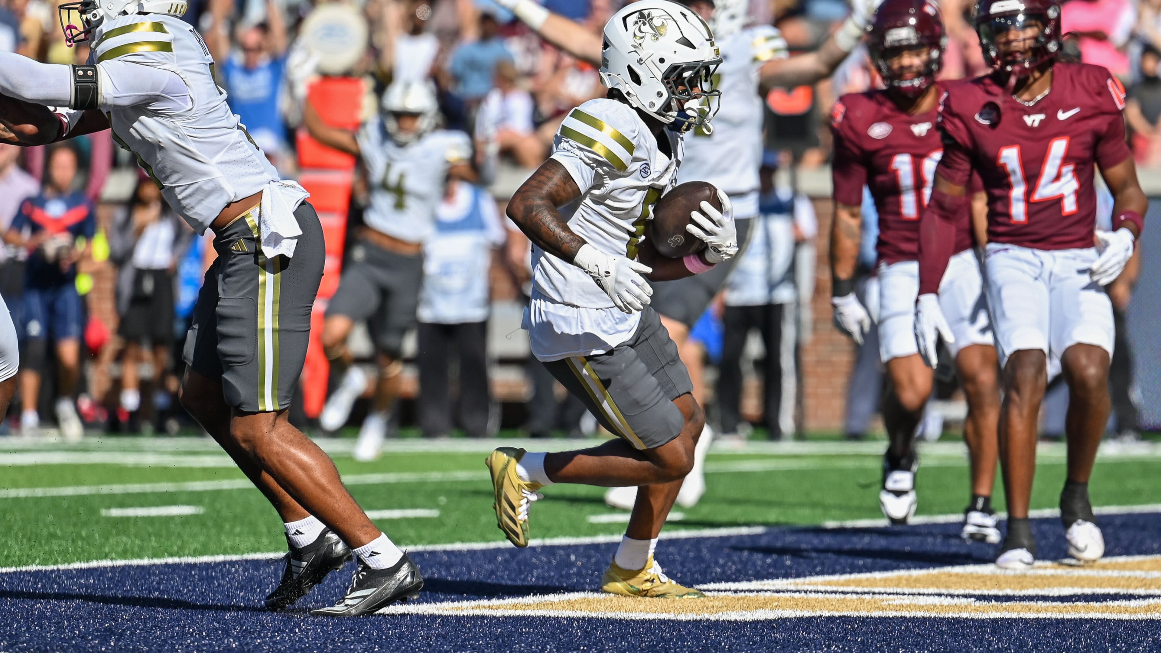 Georgia Tech wide receiver Malik Rutherford (8) carries the ball into the end zone for a touchdown against Virginia Tech during the first half of an NCAA college football game, Saturday, Oct. 11, 2025 at Bobby Dodd Stadium in Atlanta. (Daniel Varnado/Atlanta Journal-Constitution via AP)