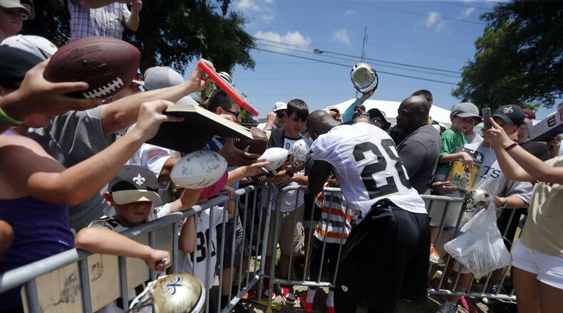 Adrian Peterson is popular with autograph seekers, but how much does he have left to help the New Orleans Saints? (AP Photo/Gerald Herbert)