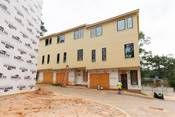 A townhome development under construction in northwest Atlanta, a project that the Atlanta Neighborhood Development Partnership is working on with a partner. (Estela Muñoz/AJC)