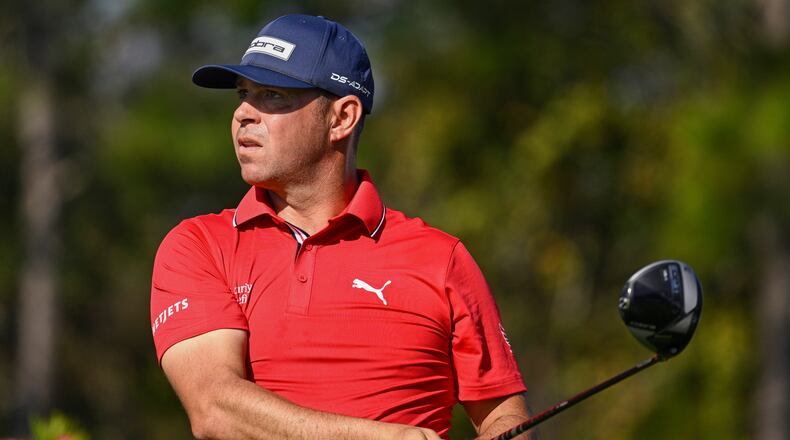 FILE - Gary Woodland looks on after hitting his tee shot on the second hole during the final round of the PNC Championship golf tournament, Dec. 21, 2025, in Orlando, Fla. (AP Photo/Phelan M. Ebenhack, File)