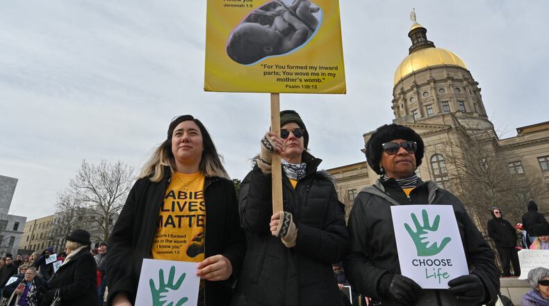 Anti-abortion advocates hold signs during the 2020 Georgia March For Life & Memorial Service to raise awareness and support of anti-abortion legislation at Liberty Plaza on Wednesday, January 22, 2020. (Hyosub Shin / Hyosub.Shin@ajc.com)