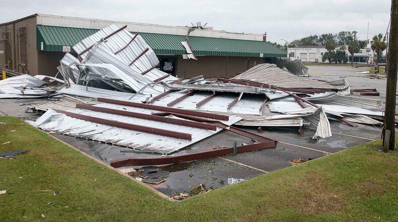 Large sheets of metal debris rest in the parking lot of the Shackleford shopping center following Hurricane Michael in Albany, Thursday, October 11, 2018. Hurricane Michael passed through Albany Wednesday evening as a Category 2 hurricane.