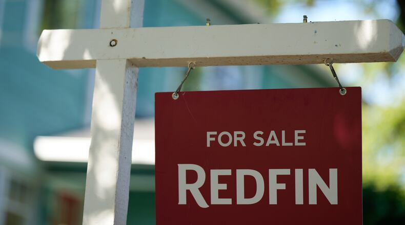 FILE - A "For Sale" sign is displayed outside a home on Friday, July 11, 2025, in Portland, Ore. (AP Photo/Jenny Kane, File)