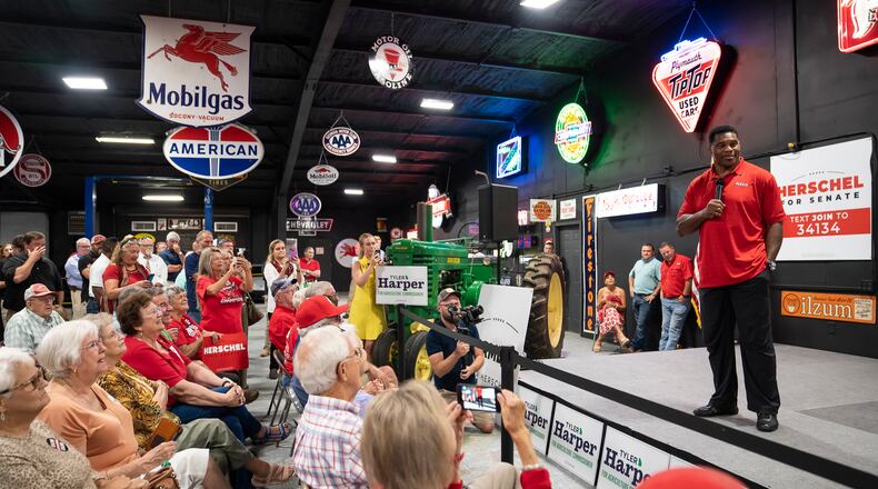 Herschel Walker, the retired football star and Republican senate candidate, holds a campaign event at a car dealership in rural in Ocilla, Georgia on July 19, 2022. The uneventful outing was noteworthy for Walker, whose candidacy has been rocked by a series of damaging reports about his business record and personal life.  (Nicole Craine/The New York Times)..